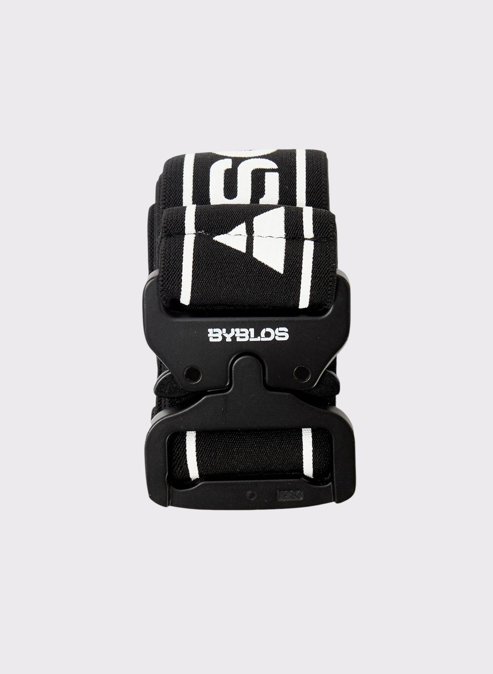 Black belt with white logo on a light gray background