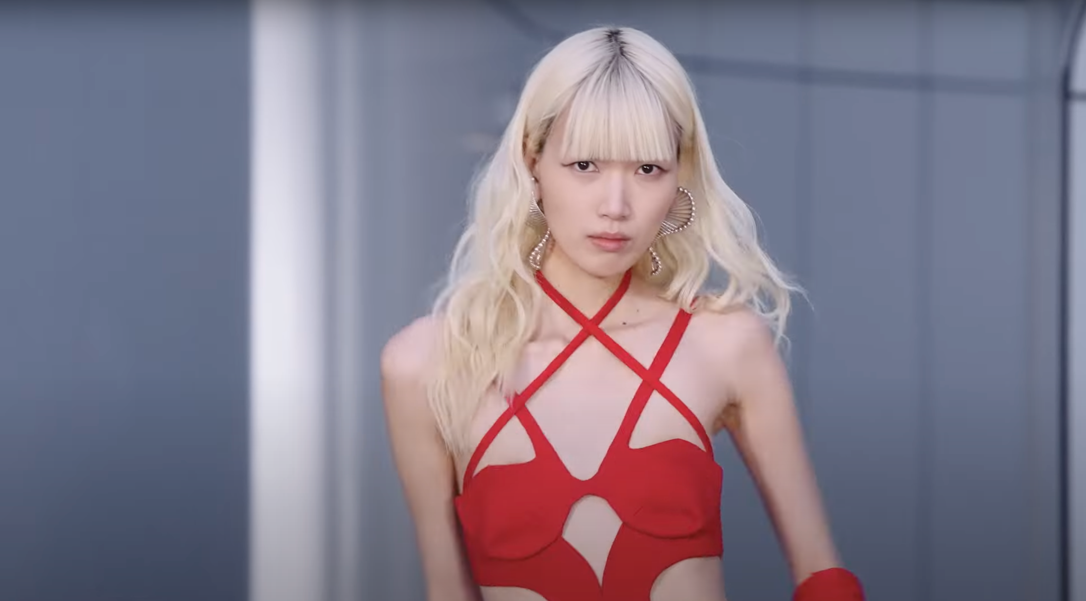 Person wearing a red outfit with a blurred background