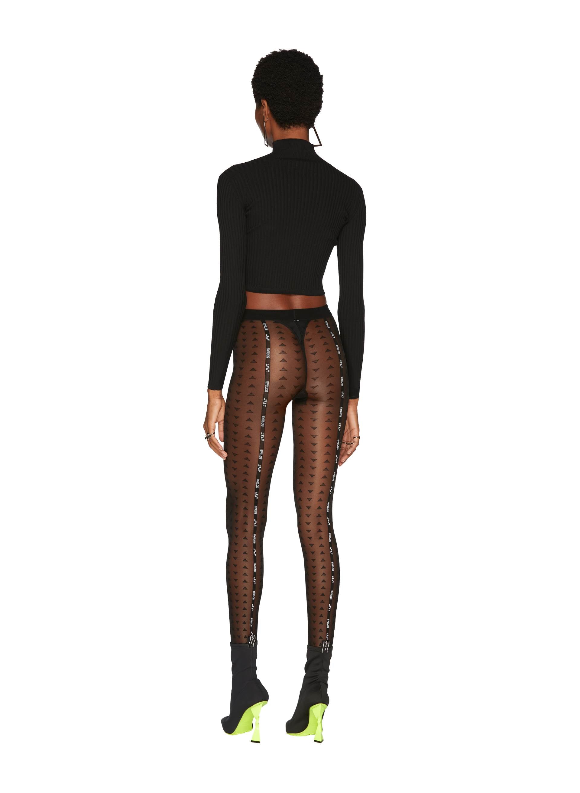 riangles See-Through Tights Black paired with a ribbed crop top with a choker detail and pointed ankle boots.