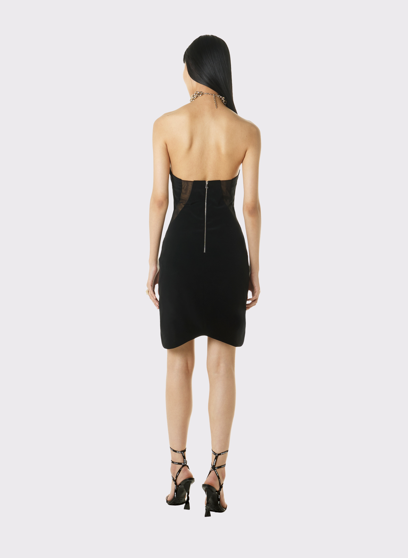 Byblos Asymmetric Mini-Dress With Chains in black - back view